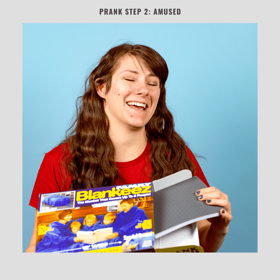 woman laughing at funny gift box